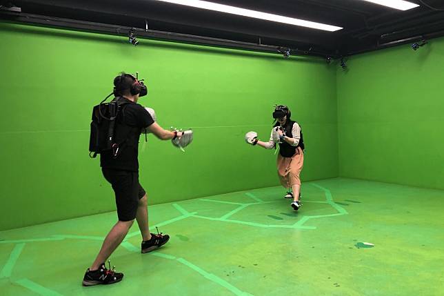 Two players fight in Unbound Fighting League, Hong Kong’s first locally developed virtual reality player-versus-player game. Photo: Sandbox VR