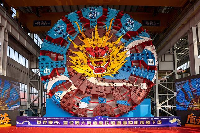 The tunnel boring machine (TBM) Dinghai is seen at an industrial park of China Railway Construction Heavy Industry Corporation Limited in Changsha, central China's Hunan Province, Jan. 10, 2024. With a diameter of 14.57 meters and a total weight of 4,350 tonnes, the TBM Dinghai will be used in the construction of Jintang undersea tunnel linking the Jintang islet of Zhoushan and the coastal area of Ningbo. (Xinhua/Chen Sihan)