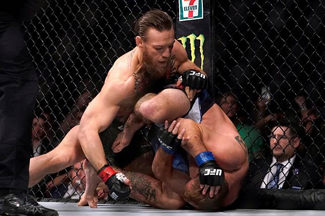 Conor McGregor pummels Donald Cerrone on the ground at UFC 246. Photo: Reuters
