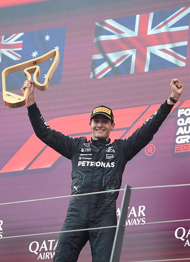 First placed Mercedes's British driver George Russell celebrates during the awarding ceremony after the Formula 1 Austrian Grand Prix race in Spielberg, Austria, June 30, 2024. (Xinhua/He Canling)