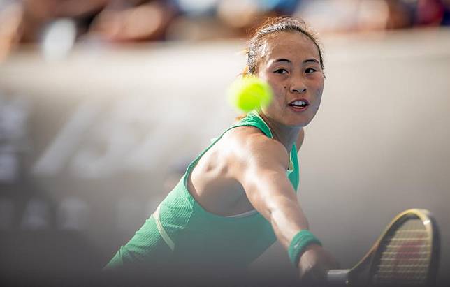 Zheng Qinwen of China hits a return during the women's singles second round match between Zheng Qinwen of China and Katie Boulter of Britain at the Australian Open tennis tournament in Melbourne, Australia on Jan. 18, 2024. (Photo by Hu Jingchen/Xinhua)