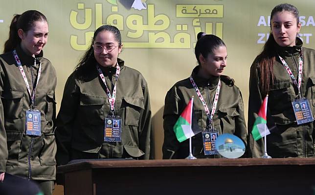 Four Israeli hostages are seen during the ceremony of their release in Palestine Square in Gaza City on Jan. 25, 2025. (Xinhua/Adul Rahman Salama)