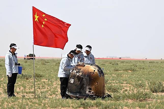 The return capsule of the Chang'e-6 probe lands in Siziwang Banner, north China's Inner Mongolia Autonomous Region on June 25, 2024. The returner of the Chang'e-6 probe touched down on Earth on Tuesday, bringing back the world's first samples collected from the moon's far side, and marking another remarkable achievement in China's space exploration endeavors. (Xinhua/Lian Zhen)