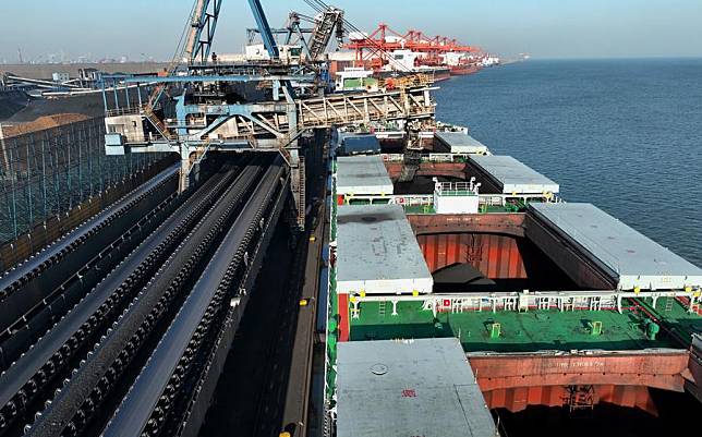 A drone photo taken on Jan. 28, 2024 shows a ship loading cargo at the coal wharf of the Tangshan Port in north China's Hebei Province. (Xinhua/Yang Shiyao)