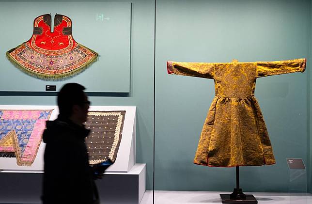 A visitor views exhibits during an exhibition titled &ldquo;Cocoon of Traditions: Silk in the National Cultures of Eurasia&rdquo; at Hubei Provincial Museum in Wuhan, central China's Hubei Province, Nov. 22, 2024. (Xinhua/Xiao Yijiu)