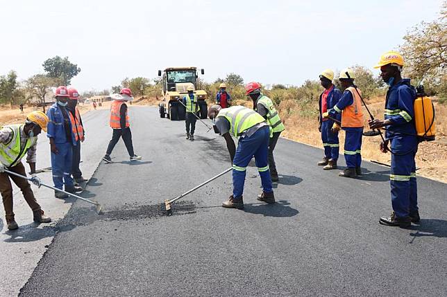 The photo taken on Aug. 27, 2024, shows asphalt pavement works on Malawi's M5 Road in Nkhotakota district, Malawi. (China Railway 20th Bureau Group/Handout via Xinhua)