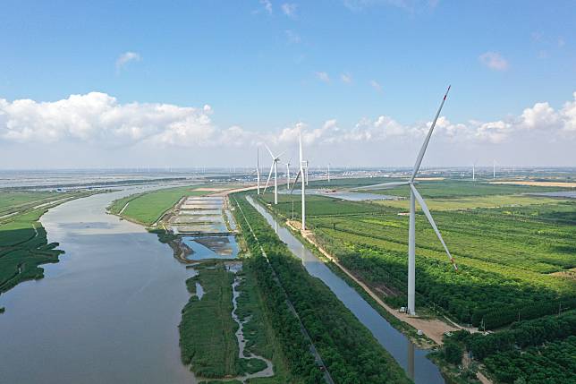 An aerial drone photo taken on June 6, 2024 shows wind power equipment at a low(zero) carbon-dioxide emission industrial park in Sheyang, Yancheng, east China's Jiangsu Province. (Xinhua/Yang Lei)