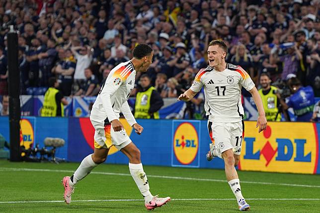 Florian Wirtz &reg; of Germany celebrates scoring during the UEFA Euro 2024 Group A match between Germany and Scotland in Munich, Germany on June 14, 2024. (Xinhua/Peng Ziyang)