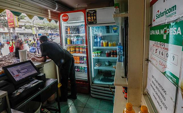 M-pesa payment information is displayed on the wall of a shop in Nairobi, capital of Kenya, Sept. 16, 2021. (Xinhua/Zhang Yu)