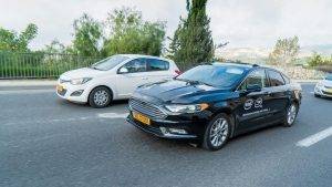 A Mobileye autonomous vehicle maneuvers through traffic in Jerusalem in December 2018. Mobileye, an Intel company, is the leader in assisted driving and a pioneer in the use of computer vision technology to save lives on the road. The company, based in Jerusalem, became part of Intel in 2017. Courtesy of Mobileye via NoCamels.