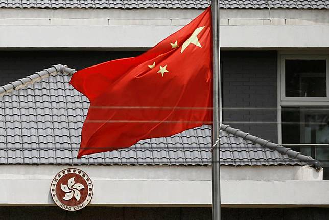 Chinese flag flutters at the office of the Government of the Hong Kong Special Administrative Region in Beijing