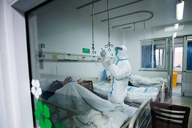 There could be many more cases in Wuhan, Hong Kong researchers say. Photo: EPA