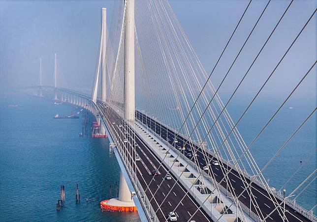 An aerial drone photo taken on Dec. 11, 2024 shows vehicles running on the Huangmaohai Bridge in south China's Guangdong Province. (Xinhua/Liu Dawei)