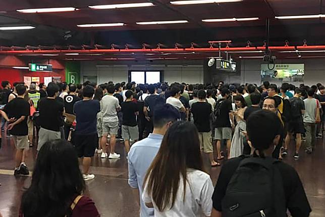 Residents gather outside the control room at Tai Koo MTR station on Tuesday evening. Photo: Facebook