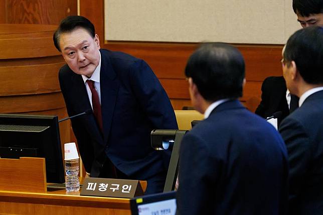 South Korea's arrested President Yoon Suk-yeol (L) attends the fourth hearing of his impeachment trial at the constitutional court in Seoul, South Korea, Jan. 23, 2025. (SeongJoon Cho/Pool via Xinhua)