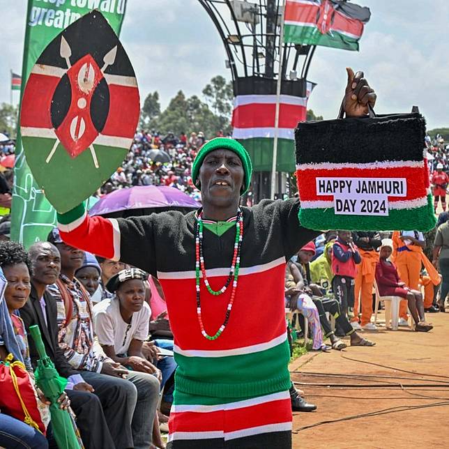 A man dons Kenyan Flag attire during Independence Day celebrations in Nairobi, capital of Kenya, Dec. 12, 2024. (Photo by Fred Mutune/Xinhua)