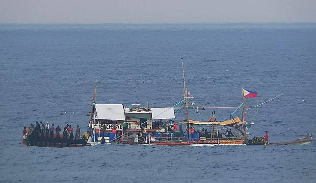 Several Philippine ships gather illegally and conduct activities irrelevant to legitimate fishing in the surrounding waters of Huangyan Dao, May 16, 2024. (CCG/Handout via Xinhua)