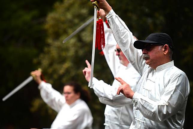 Tai Chi practitioners perform during a Chinese cultural event held at the Chinese Garden of Serenity in Santa Lucija, Malta, on April 27, 2024. (Photo by Jonathan Borg/Xinhua)
