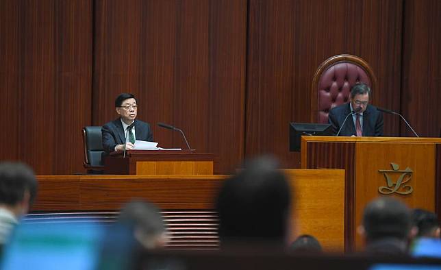 John Lee (L), chief executive of the Hong Kong Special Administrative Region (HKSAR), delivers his third policy address to the HKSAR Legislative Council in Hong Kong, south China, Oct. 16, 2024. (Xinhua/Chen Duo)