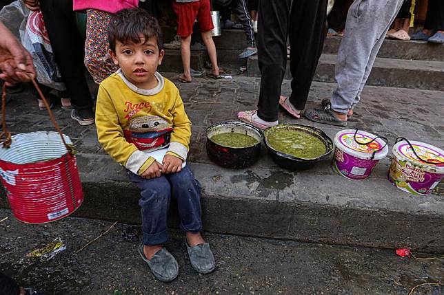 A Palestinian child is seen at a food distribution center in the city of Deir al-Balah in central Gaza Strip, on Oct. 25, 2024. (Photo by Rizek Abdeljawad/Xinhua)