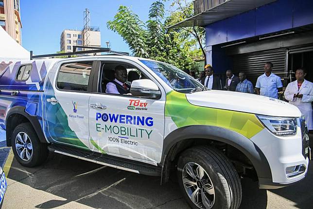 Kenya Power Managing Director Joseph Siror (Front) drives a JAC electric vehicle from China in Nairobi, Kenya, on April 22, 2024. (Photo by Allan Mutiso/Xinhua)