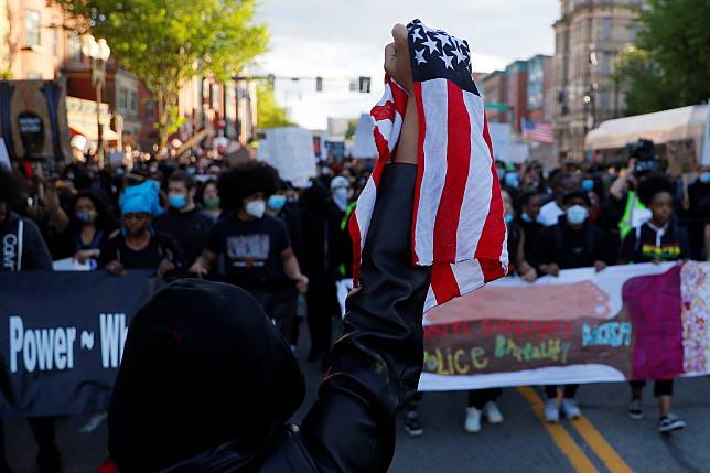 Protestors rally against the death in Minneapolis police custody of George Floyd in Boston