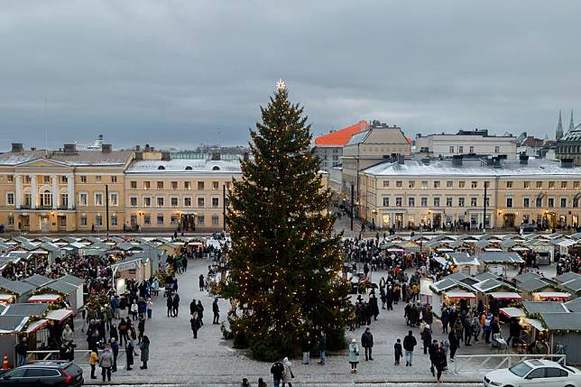 People visit the Christmas Market at the Senate Square in Helsinki, Finland, Dec. 8, 2024. (Photo by Matti Matikainen/Xinhua)