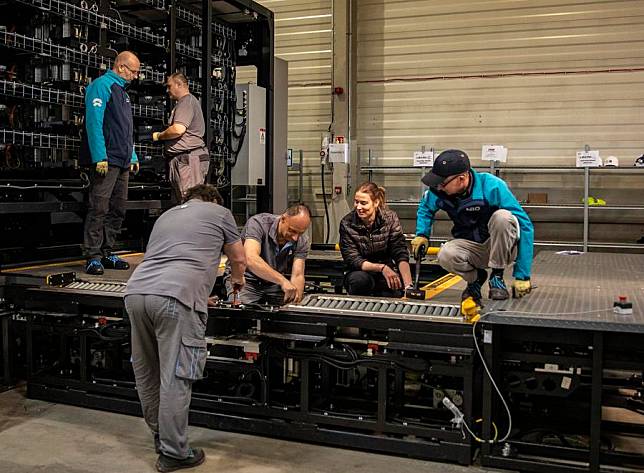 Staff members work at the NIO Power Europe Plant in Biatorbagy, Hungary, March 18, 2024. (Xinhua/Zhang Fan)