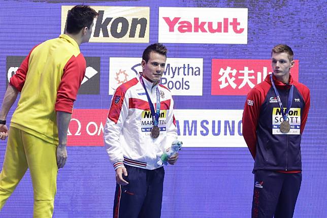 Britain’s bronze medallist Duncan Scott looks to Sun Yang (left) as the Chinese gold medallist shouts at him. Photo: AP