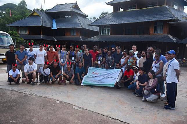 Agricultural experts and government officials from 13 Belt and Road countries pose for a group photo in Hebian Village, Xishuangbanna Dai Autonomous Prefecture, southwest China's Yunnan Province, June 27, 2024. (Photo by Dong Bohuai/Xinhua)