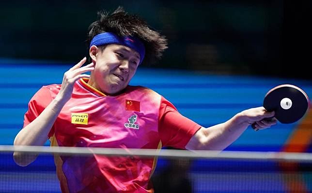 Wang Chuqin of China hits a return during the men's singles quarterfinal match against Jang Woo-jin of South Korea at the ITTF World Cup at Galaxy Arena in Macao, China, April 19, 2024. (Xinhua/Wang Shen)