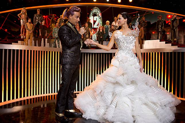 HUNGER GAMES, THE: CATCHING FIRE (2013) - STANLEY TUCCI - JENNIFER LAWRENCE.