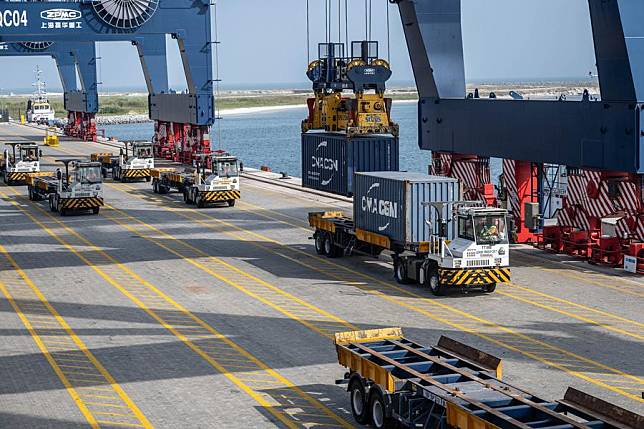 Containers are being loaded onto a truck at Lekki Port in Lagos, Nigeria, on Nov. 30, 2024. Lekki Port, a commercial cooperation project constructed by China Harbour Engineering Company Ltd., stands as Nigeria's first deep seaport and one of the largest of its kind in West Africa. (Xinhua/Wang Guansen)