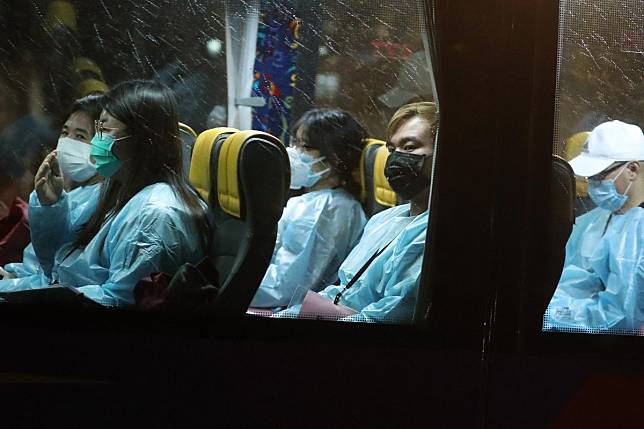 Hongkongers brought back from Hubei province head straight from their flight to a government quarantine centre in March. Photo: Sam Tsang