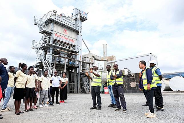 Students from Buhimba Technical Institute tour a stone quarry near a Chinese road construction camp in Uganda's western district of Kikuube, on Oct. 28, 2024. (Photo by Hajarah Nalwadda/Xinhua)