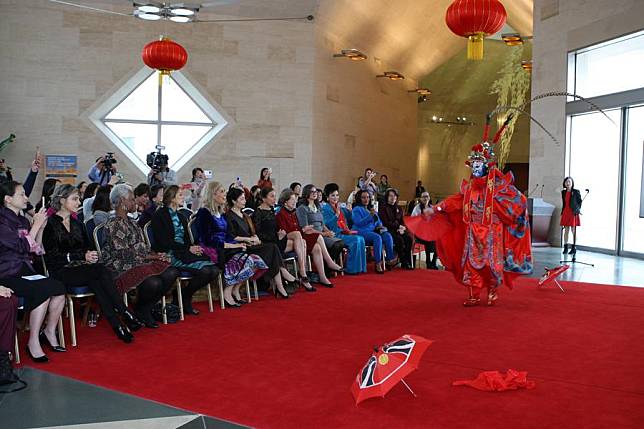 Guests enjoy a Sichuan opera face-changing performance at the Chinese Embassy in the United States in Washington, D.C., on Dec. 20, 2024. (Xinhua/Yan Liang)