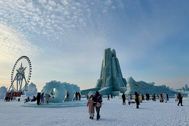 Tourists visit the Harbin Ice-Snow World, the world's largest ice-and-snow theme park, in Harbin, the capital city of northeast China's Heilongjiang Province, Dec. 21, 2024. (Xinhua/Yang Siqi)