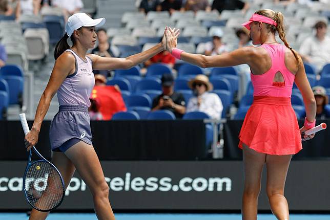 Zhang Shuai (L) and Kristina Mladenovic react during their Australian Open women's doubles third round win against Chan Hao-Ching and Lyudmyla Kichenok in Melbourne, Jan. 20, 2025. (Photo by Chu Chen/Xinhua)