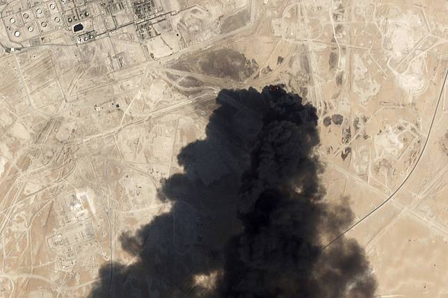 A satellite image shows thick black smoke rising from Saudi Aramco’s Abqaiq oil processing facility in Buqyaq after the drone strikes on Saturday. Photo: Planet Labs via AP