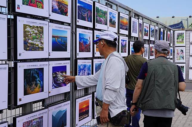 People visit a photo show during the 24th Pingyao International Photography Festival in Pingyao County, north China's Shanxi Province, on Sept. 19, 2024. (Xinhua/Chen Zhihao)