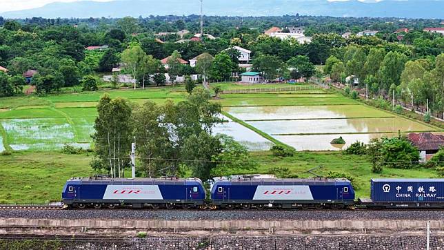 In this aerial drone photo, a fully loaded train operated independently by a Lao train driver leaves for Kunming, southwest China's Yunnan Province, from Vientiane Station in Vientiane, Laos, Aug. 5, 2024. (Photo by Yang Yongquan/Xinhua)