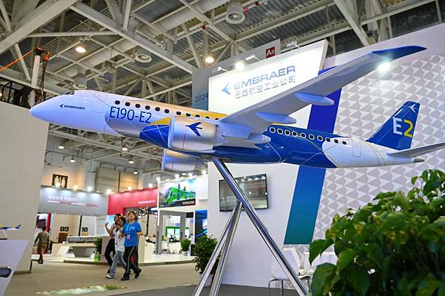 A model of E190-E2 aircraft is on display at the exhibition of BRICS New Industrial Revolution 2024 in Xiamen, southeast China's Fujian Province, Sept. 10, 2024. (Xinhua/Lin Shanchuan)