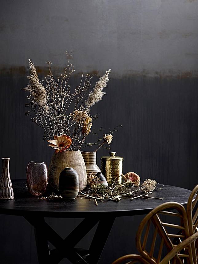Dried flowers and dark hues of charcoal, brown and burgundy lend a refined austerity to your holiday decor, image courtesy of Bloomingville; header image courtesy of H&M Home