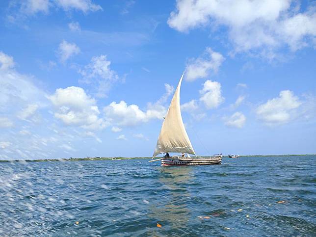 People sail a dhow in Indian Ocean, Lamu County, Kenya, on Nov. 23, 2022. Local and non-residents have thronged Lamu archipelago at Kenyan coast to celebrate the 20th edition of Lamu annual cultural festival. (Photo by Mukoto Imbova/Xinhua)