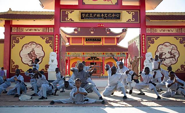 A martial art master and students perform Kungfu during a Chinese Lunar New Year celebration event at the Shaolin Temple cultural center in Lusaka, Zambia, Feb. 9, 2024. (Xinhua/Peng Lijun)