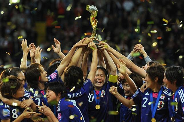 Japan’s national women’s football team celebrates with the Fifa Women’s Football World Cup trophy after defeating USA in the final in 2011. Photo: AFP