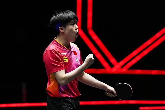 Wang Chuqin celebrates during the men's singles round of 16 match against Patrick Franziska of Germany at World Table Tennis (WTT) Finals Fukuoka 2024 in Kitakyushu, Japan, Nov. 21, 2024. (Xinhua/Zhang Xiaoyu)