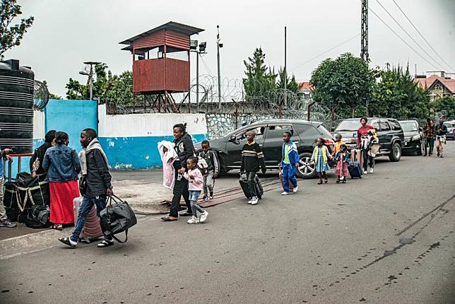 United Nations (UN) staff and their family are seen outside the UN peacekeeping mission bureau in Goma, North Kivu province, eastern Democratic Republic of the Congo (DRC), Jan. 25, 2025. (Photo by Zanem Nety Zaidi/Xinhua)