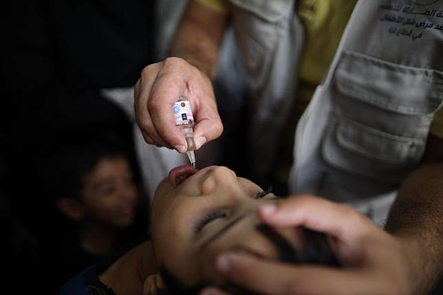 A child receives a dose of the polio vaccine in the Al-Maghazi refugee camp, central Gaza Strip, on Sept. 2, 2024. (Photo by Marwan Dawood/Xinhua)