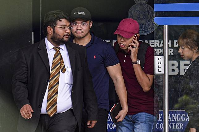 Haziq Abdul Aziz (second from left) claimed he had a same-sex affair with Azmin Ali, the influential economic affairs minister. Photo: EPA